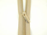 Sallie Tomato - Nylon Gold Coil Zippers: 3 Yards with 9 Pulls - Beige #5